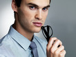 Thoughtful young male executive thinking