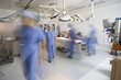 Surgeons in operating room preparing for surgery