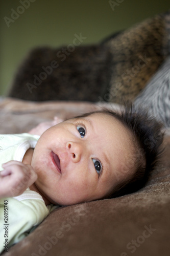Photo: Mixed race newborn baby laying on blanket Mixed race newborn baby laying on blanket