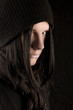 Young goth man on black