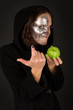 Two-faced sorceress with green apple tempts