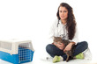 Photo: woman vet stroking cat, transporter in background woman vet stroking cat, transporter in background