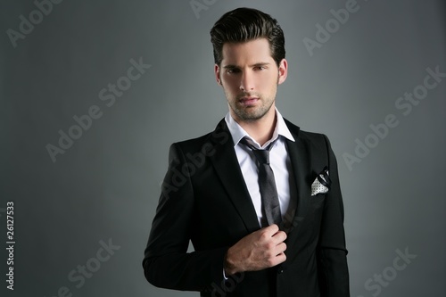 Photo: Fashion young businessman black suit casual tie Fashion young businessman black suit casual tie