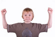 a young boys with arms aloft