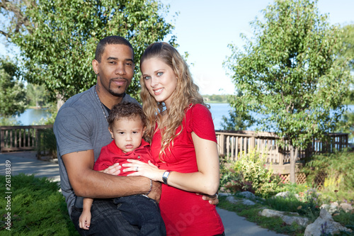 Photo: Interracial Family in Park Interracial Family in Park