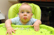 Funny boy getting all dirty while eating
