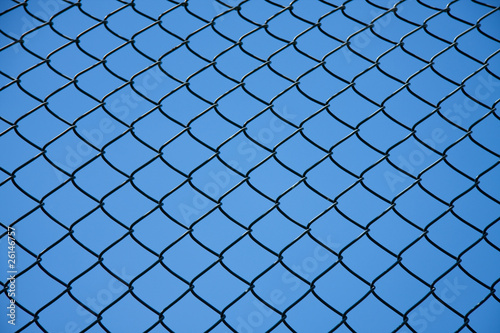 Photo: a separation fence against a blue sky a separation fence against a blue sky