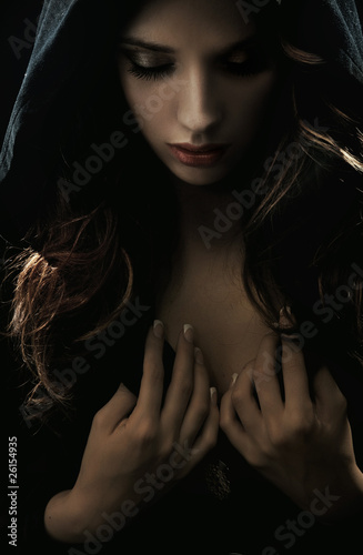 Photo: Portrait of a young woman in hood Portrait of a young woman in hood