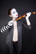woman mime playing the violin