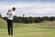 Golfer hitting the ball Golfer hitting the ball