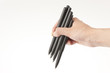 many black pens in hand many black pens in hand