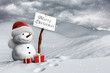 Pupazzo di neve con cartello