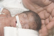 Newborn and hand