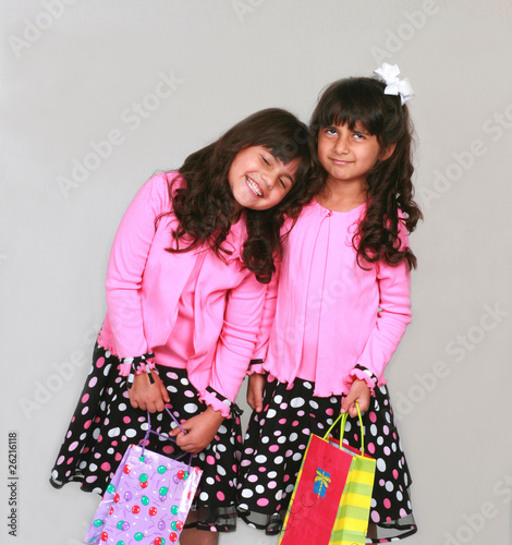 Photo: Indian and Hispanic girls in party dresses Indian and Hispanic girls in party dresses
