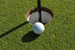 golf ball at the cup