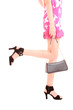 long woman legs in high heels isolated on white