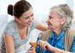 Senior woman with her home caregiver Senior woman with her home caregiver