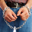 hands chained metal chain