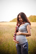 A pregnant woman in the park A pregnant woman in the park