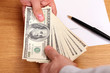 Businessmen passing money with contract on the background Businessmen passing money with contract on the background