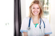 Photo: A pretty young woman nurse inside hospital building A pretty young woman nurse inside hospital building