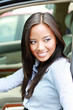 beautiful brunette asian businesswoman in a car
