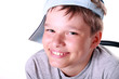 Photo: Little happy boy in a blue cap smiling Little happy boy in a blue cap smiling