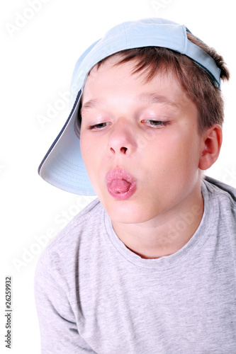 Photo: Boy in cap showing his tongue Boy in cap showing his tongue