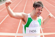 Exulting sprinter showing expression of victory in front of the