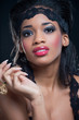 Portrait of young black woman, isolated on black