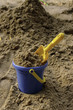 The full bucket of sand with scoop The full bucket of sand with scoop