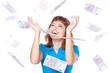 Banknotes of 500 euro are falling on red-haired girl Banknotes of 500 euro are falling on red-haired girl