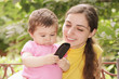 Baby girl looking at phone receiver