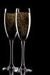 A glass of champagne, isolated on a black background. A glass of champagne, isolated on a black background.