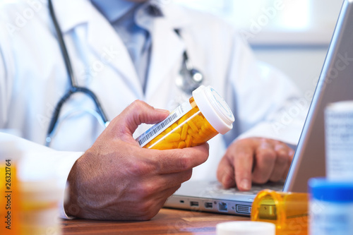 Photo: Doctor preparing online internet prescription Doctor preparing online internet prescription