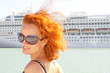 Smiling woman and cruise ship on background