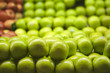 Green Apples Piled up at Supermarket