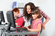 Teacher and children learning to use computer Teacher and children learning to use computer
