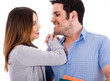 Beautiful couple smiling and facing each other