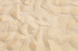 Foto: texture of yellow sand on the beach texture of yellow sand on the beach