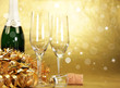 Champagne glasses on golden background