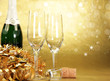 Champagne glasses on golden background