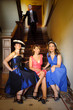 Young women in vintage clothing talk about men
