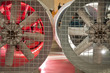 Industrial fans side by side with a metal grate,