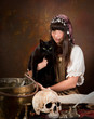 Young witch with black cat