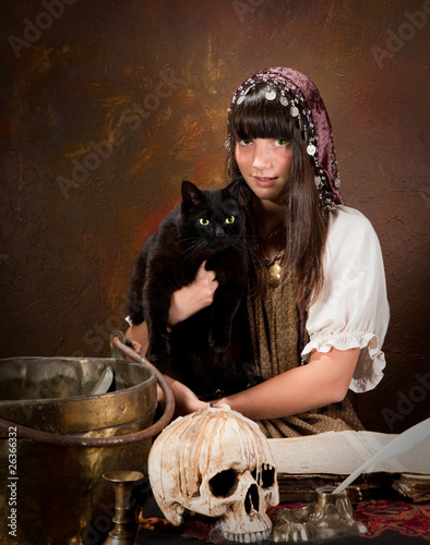 Photo: Young witch with black cat Young witch with black cat