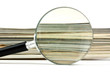 magnifying glass and magazines