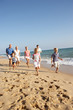 Portrait Of Three Generation Family On Beach Holiday