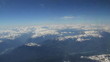 Aerial view of snow capped mountains from airplane Aerial view of snow capped mountains from airplane
