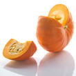 Cut orange Pumpkin on white background. Back-lit.